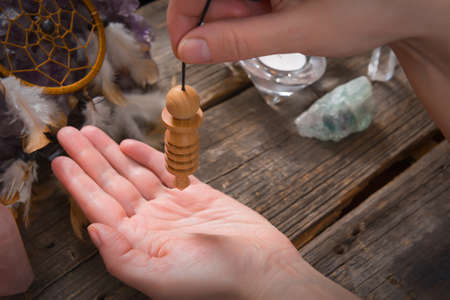 Palm reading, characterization and foretelling the future through the study of the palm with pendulumの写真素材