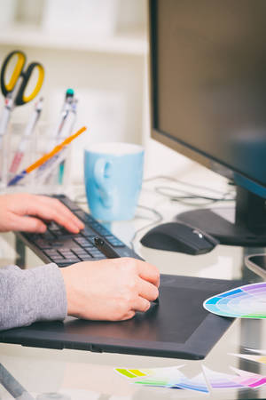 Designer using graphics tablet in the officeの写真素材
