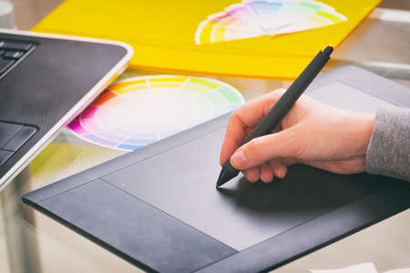 Designer using graphics tablet in the officeの写真素材