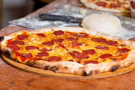 Fresh original Italian pizza, preparation in traditional style.の写真素材