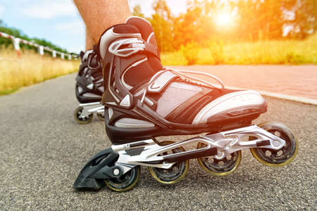 Roller blading outdoors, male legsの写真素材