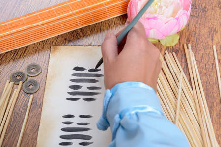 I ching ancient Chinese oracle with the I Ching hexagram, old coins and stalksの写真素材