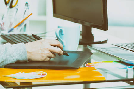 Designer using graphics tablet in the office