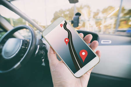 Closeup of smartphone in hand with navigation on screen