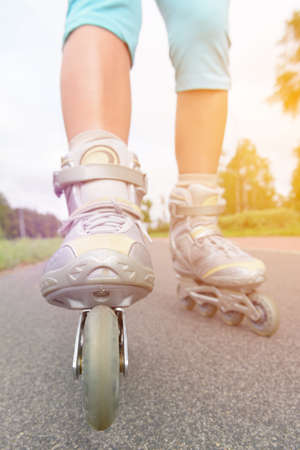 Woman on roller skates riding outdoors