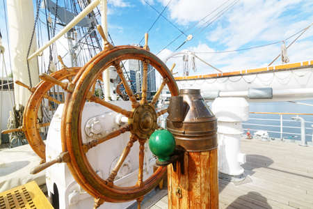 Beautiful wooden steering wheel on a big sailing shipの写真素材
