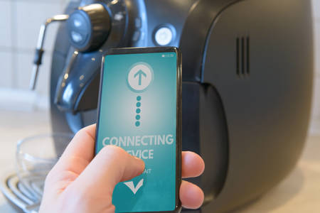 Connecting coffee machine with smart phone. Smart home and Internet of Things IoT conceptの写真素材