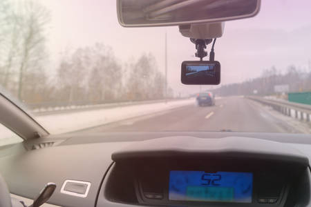 Using dashboard camera to continuously record a view through a vehicle's front windscreen