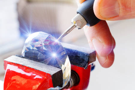 Using a high speed rotary multi tool to engrave ornament on the crystal