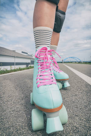 Woman rollerskater wearing knee protector pads on her legの写真素材