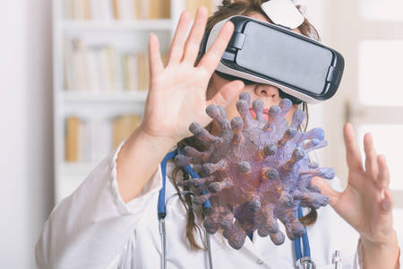 Medical doctor using virtual reality headset for coronavirus researchの写真素材