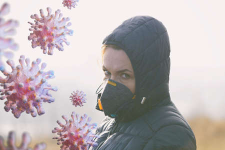 Woman wearing a real anti-pollution and anti-viruses face mask outside. SARS COVID-19 pandemic...