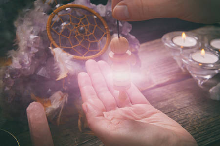 Palm reading, characterization and foretelling the future through the study of the palm with pendulumの写真素材