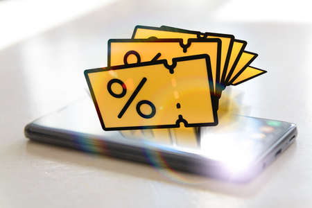 Smart phone with promo code coupons, concept of mobile phone application and shopping.の写真素材