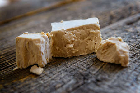 Fresh pressed active yeast, such yeast is used for baking bread and cakes as well as for beer production Saccharomyces cerevisiaeの写真素材