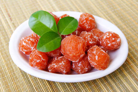 Salted plum with green Leafの写真素材