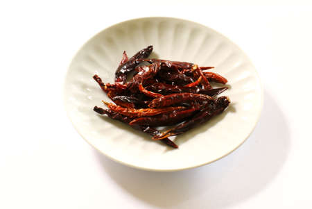 Dried Chilli on white dishの写真素材
