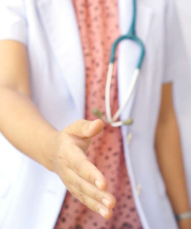 doctor offering her handshakeの写真素材