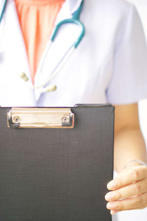 doctor holding clipboardの写真素材