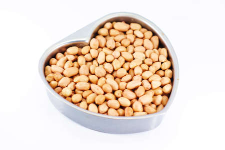 peanut in heart shape containerの写真素材