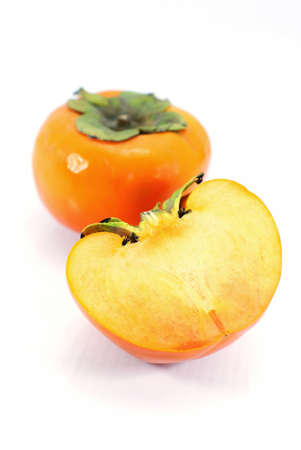 Two ripe persimmons isolated on white の写真素材