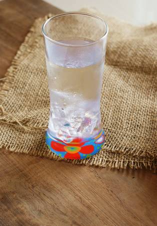 glass of water on burlapの写真素材