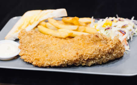 Fried fish with chunky chips.の写真素材