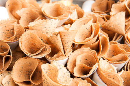 Thai biscuit curl with black sesame seeds, thai dessertの写真素材