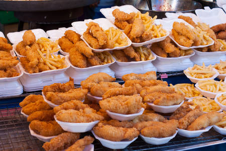 Fresh fried chicken and French fries on food shopの写真素材