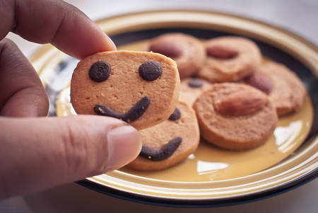 Round cookies with smiling facesの写真素材