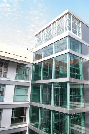 green tall building with blue sky backgroundの写真素材