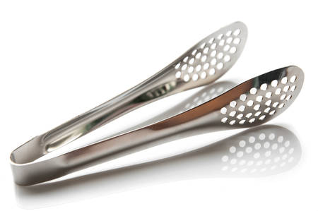 Serving kitchen tongs isolated on a whiteの写真素材
