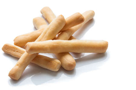 Bread sticks in napkin on wooden .