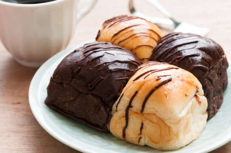 Freshly baked two- color bread loaf with cup of coffeeの写真素材