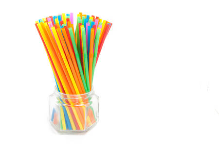 Colored plastic drinking straws on a white backgroundの写真素材