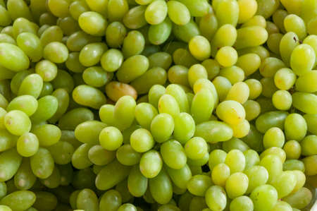 White wine grapes in a marketの写真素材