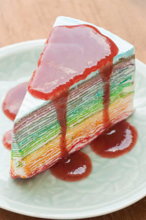 Rainbow crape cake on plate. (Selective Focus)の写真素材