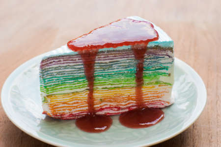 Rainbow crape cake on plate. (Selective Focus)