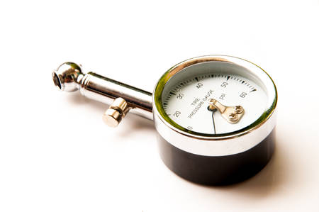 Tire pressure gauge isolated white backgroundの写真素材