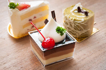 different pieces of cake. Isolated on white backgroundの写真素材
