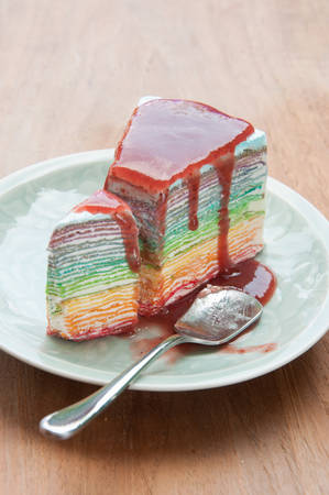 Rainbow crape cake on plate. (Selective Focus)の写真素材