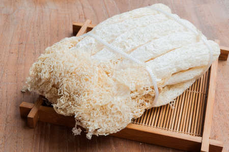 Dried Bamboo mushroom on wooden background.の写真素材