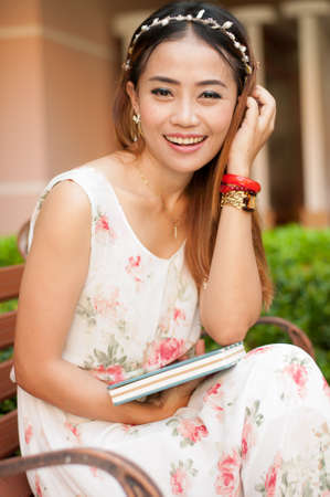 Portrait of Young smart student with books standing.の写真素材