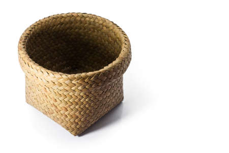 wicker basket isolated on white backgroundの写真素材