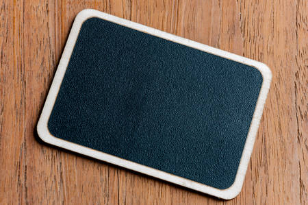 Blackboard on wooden の写真素材