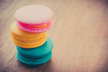 colourful stack flavoured macaron on white wood backgroundの写真素材