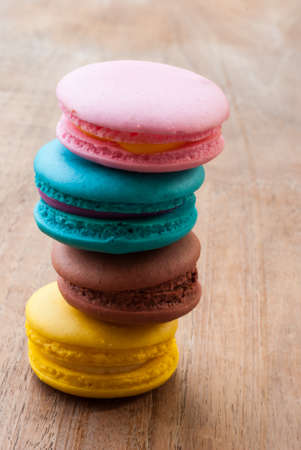 colourful stack flavoured macaron on white wood backgroundの写真素材