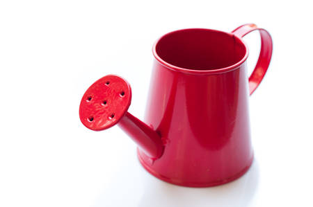 White watering can. It is isolated on a white backgroundの写真素材