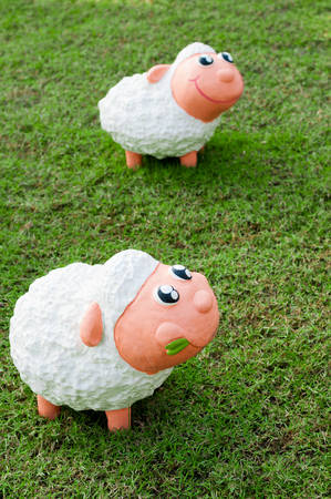 lovely sheep doll on the grassの写真素材