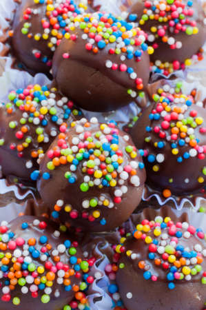 chocolate ball with topping in paper cupの写真素材